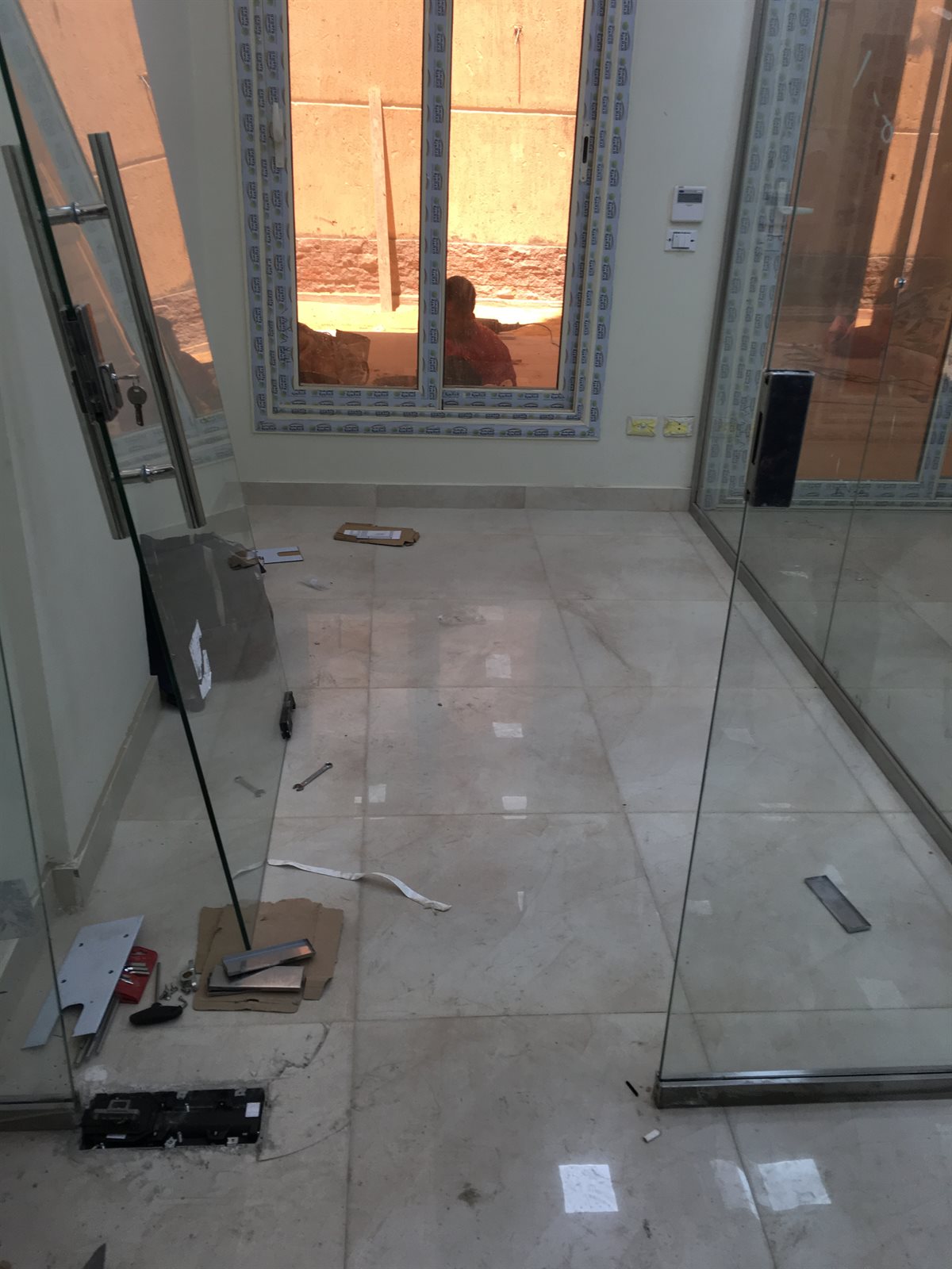 Castel frameless glass partition installation