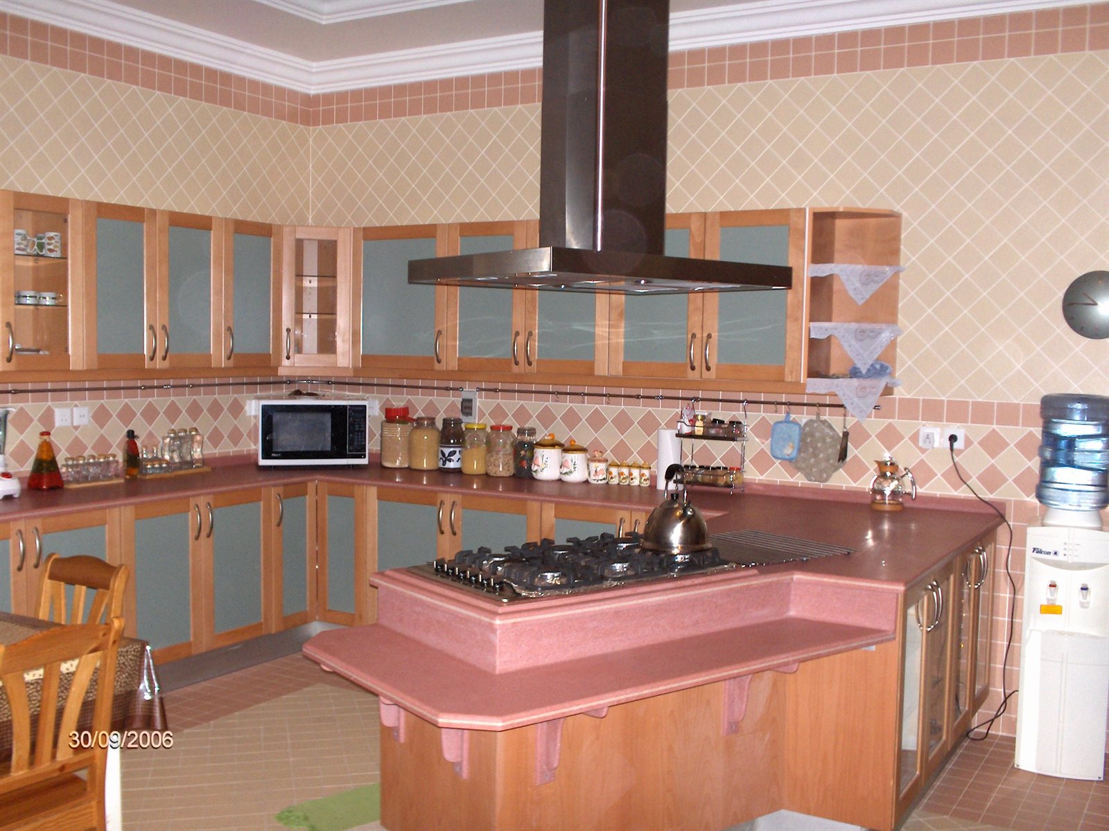 Kamal kitchen with island and extractor hood