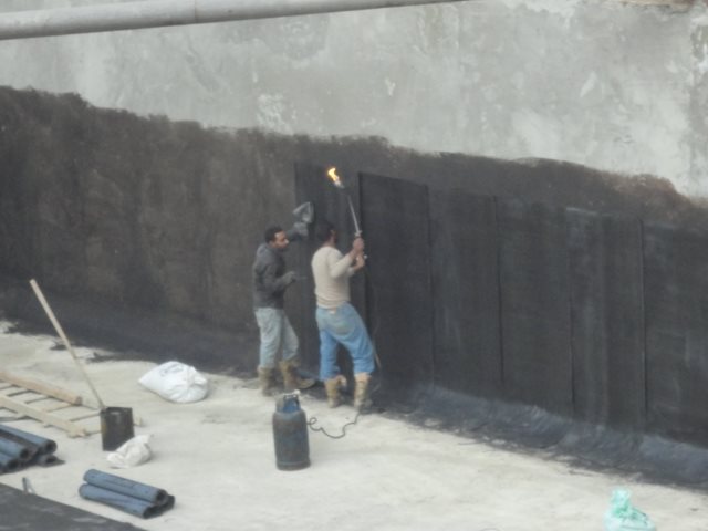 Sheriff Plaza wall waterproofing torch applied